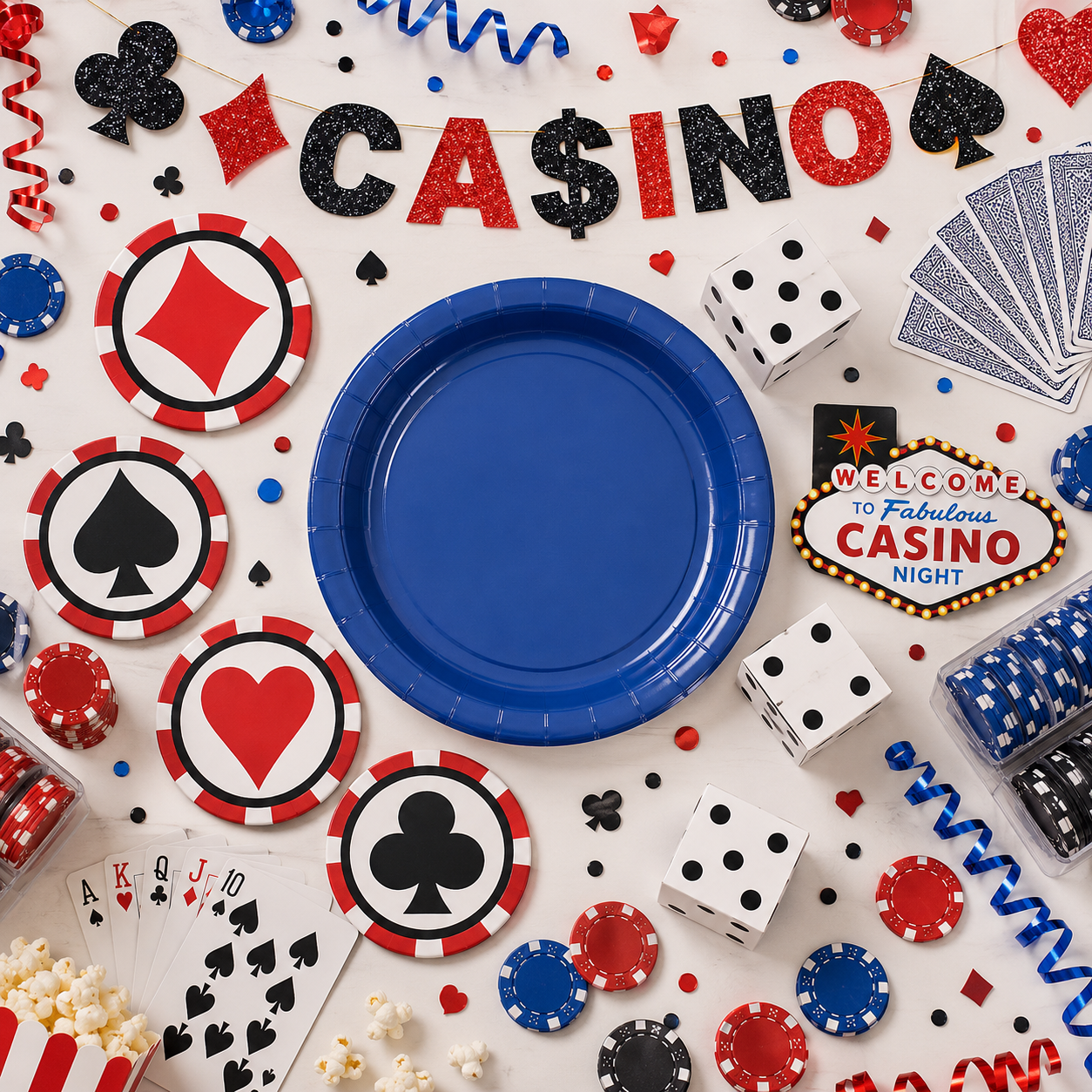 Casino party setup with blue plate, casino banner, playing cards, dice, poker chips, suit coasters, popcorn, red and blue ribbons, confetti, and casino night decor.