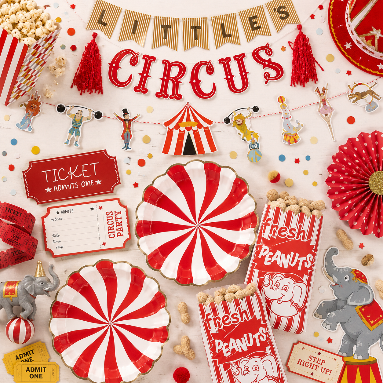 Circus party setup with red-and-white striped plates, circus banner, ticket invitations, performer garland, popcorn, peanut bags, elephant cutouts, red tassels, paper fans, and colorful confetti.