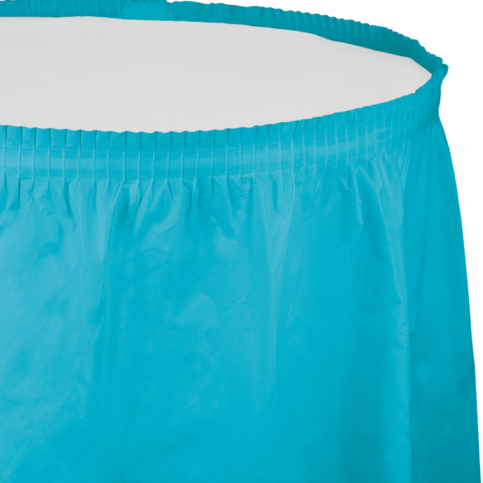 Bermuda blue plastic tableskirt with pleated elastic waistband and draped fabric panel displayed against white background.