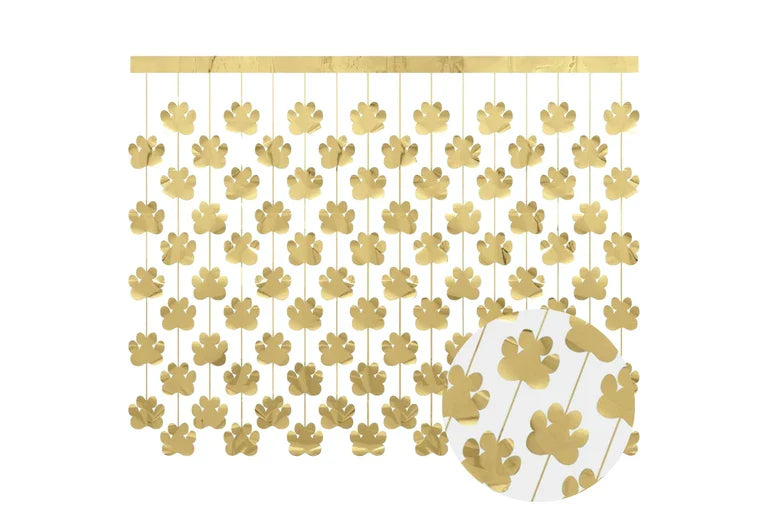 Decorative gold paw print mobile with a wooden base on a white background
