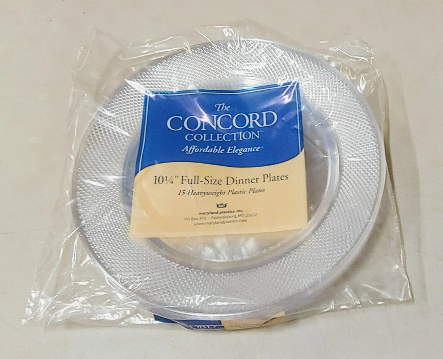 Stack of 15 clear plastic dinner plates with textured surface in original packaging, labeled "The Concord Collection" with blue and cream colored label indicating 10¼" full-size dinner plates.