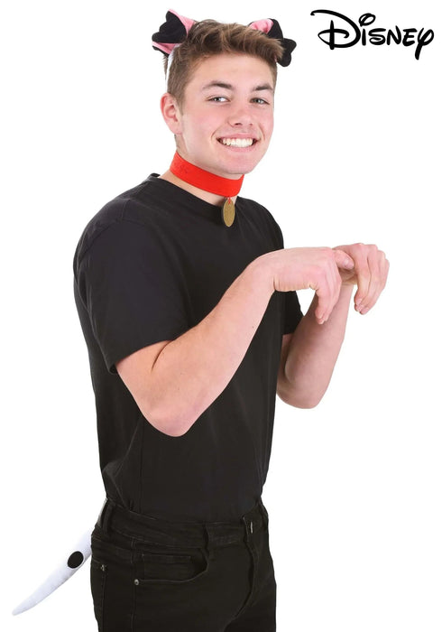 Young person wearing a black shirt styled as Pongo from 101 Dalmatians, with pink and black cat ears headband, red collar with gold pendant, and white tail accessory.