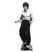 Life-size cardboard standup of a shirtless man with dark hair in a martial arts pose, wearing black pants and white socks, with red lines illustrated across his chest and face.