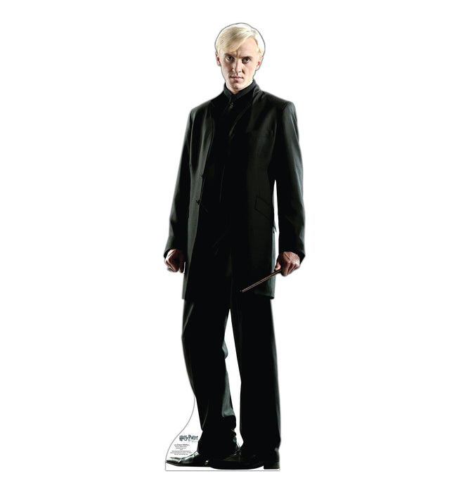 Life-size cardboard standup of a pale-haired figure in a long black suit jacket and trousers, holding a wand, against a white background.