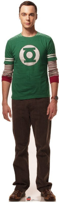 Man wearing a green crewneck t-shirt with a white circular logo on the chest and striped sleeves, paired with brown pinstriped pants.