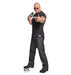 Lifesize cardboard standup of a bald man wearing sunglasses, a black WWE t-shirt, and dark jeans, holding a microphone while pointing toward the viewer.