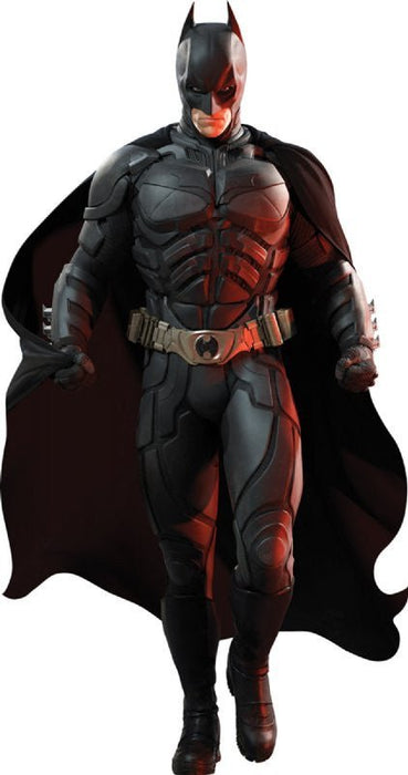 Batman figure in black armor suit with red chest emblems and cape, standing in frontal pose against white background.