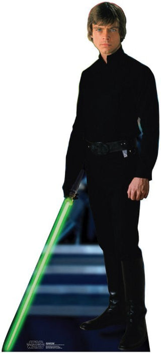 Life-size cardboard standup figure of a young man in all-black Jedi robes holding a glowing green lightsaber against a starry blue background.