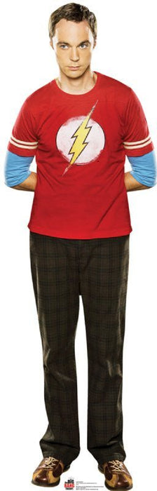 Man wearing a red t-shirt with a yellow lightning bolt symbol on the chest, blue long-sleeve shirt underneath, and dark plaid pants, standing against a white background.