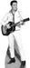 Black and white cardboard standup cutout of a man in a white western-style shirt and pants holding an acoustic guitar, smiling toward the right.
