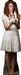 Woman with long curly reddish-brown hair wearing a cream-colored tiered dress, holding a cross and candle, displayed as a life-size cardboard standup figure.