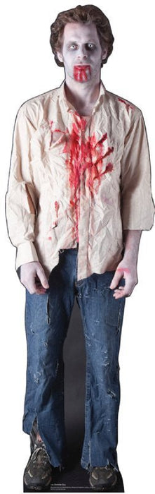 Lifesize cardboard standup of a zombie man wearing a stained beige shirt with bloody handprints and a mouth covered in red makeup, paired with distressed blue jeans.