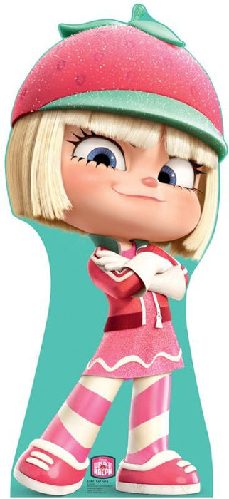 Cardboard standup cutout of an animated girl character with blonde bangs wearing a pink and mint green outfit, matching hat, and striped socks.