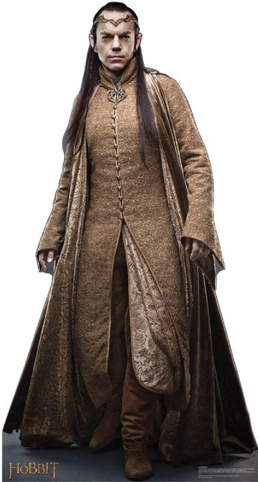 Tall cardboard standup figure wearing a long brown and gold brocade robe with a flowing dark cloak, ornate headpiece, and long dark hair against a white background.