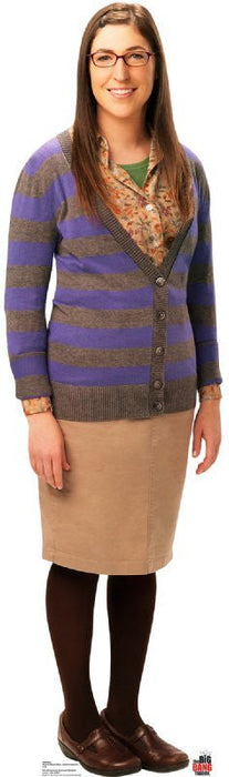 Cardboard cutout of a woman wearing glasses, a purple and brown striped cardigan over a patterned green shirt, tan skirt, and black tights with brown shoes.