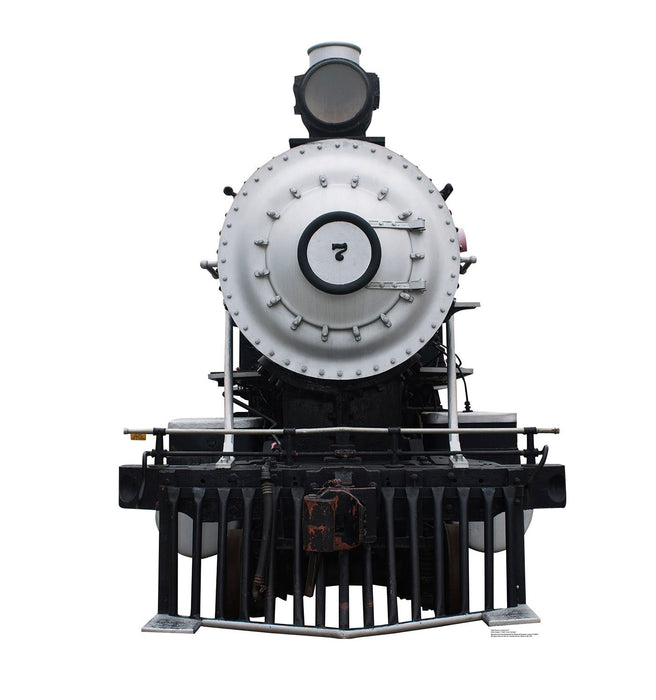White and black steam locomotive #7 with riveted boiler, smokestack, and red cowcatcher mounted on a black display stand.