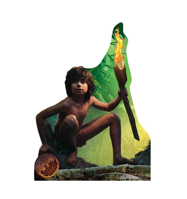 Life-size cardboard cutout of a young boy with dark hair holding a flaming torch, wearing jungle attire, with a large green and yellow leaf-shaped backdrop and a glowing circular object at the base.