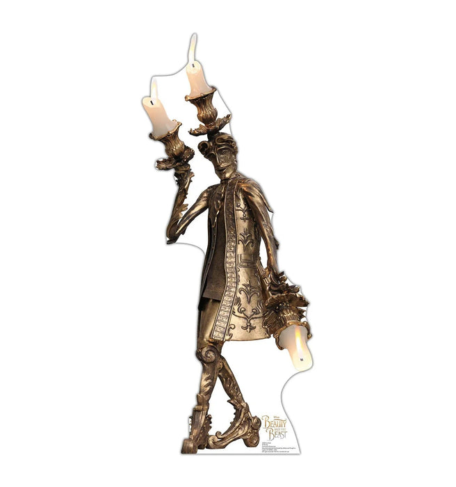 Bronze-colored ornate candelabra figure wearing an elaborate coat with decorative details, holding two lit candles, displayed as a cardboard standup.