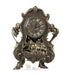 Ornate brass and bronze decorative clock featuring Roman numerals on the face, elaborate scrollwork handles, and a mechanical cannon mechanism at the base, designed as a life-sized cardboard standup.