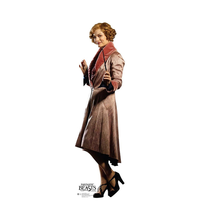 Woman with curled reddish-brown hair wearing a tan wool coat with red collar and black platform heels, standing against a white background with "Fantastic Beasts" text at the bottom.