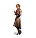 Woman with curled reddish-brown hair wearing a tan wool coat with red collar and black platform heels, standing against a white background with "Fantastic Beasts" text at the bottom.