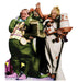 Cardboard cutout of two rotund figures in colorful costumes from The Wizard of Oz, one in green with purple shoes and one in white with a tall hat, posing together with props including a basket and decorative items.