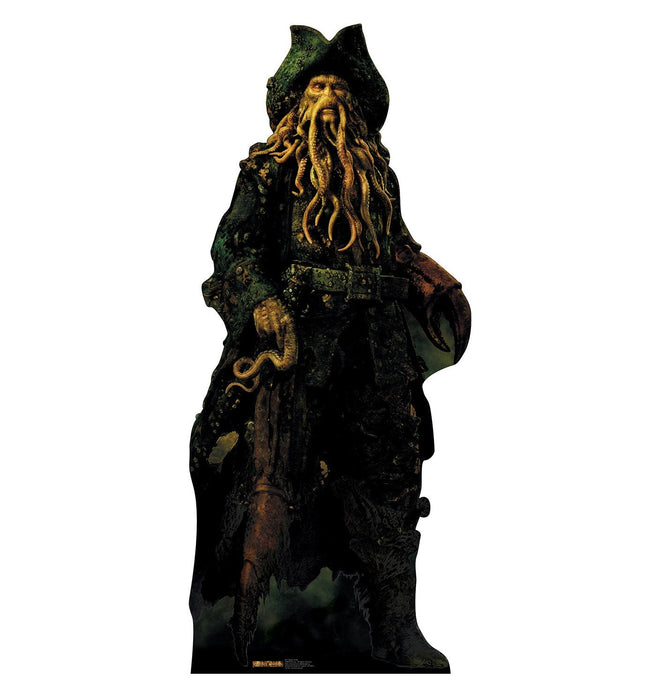 Lifesize cardboard standup figure of a weathered pirate captain with long golden tentacle-like beard, wearing a black tricorn hat and tattered dark coat with green moss-like texture and rust-colored patches.