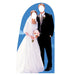 Life-size cardboard cutout of a bride in a white lace wedding dress holding a bouquet and a groom in a black tuxedo with boutonniere, both with blank white faces, set against a blue arched background.