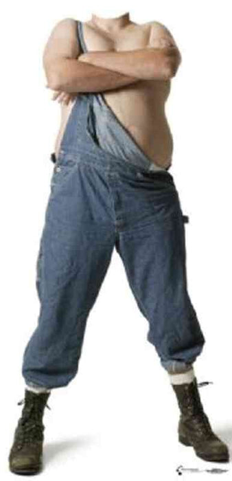 Shirtless man with crossed arms wearing loose blue jeans and green lace-up boots in a wide-legged stance.