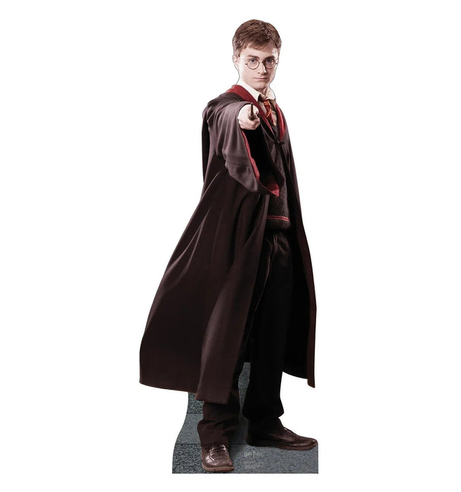Life-size cardboard standup of a young wizard wearing round glasses, a burgundy and gold striped tie, and a long dark brown robe with red lining, pointing forward while looking over his shoulder.