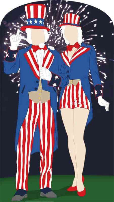 Two patriotic cardboard standups featuring faceless Uncle Sam and Aunt Sam figures dressed in blue jackets with red and white striped pants and skirts, tall hats, and bow ties against a dark background with fireworks.