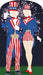 Two patriotic cardboard standups featuring faceless Uncle Sam and Aunt Sam figures dressed in blue jackets with red and white striped pants and skirts, tall hats, and bow ties against a dark background with fireworks.