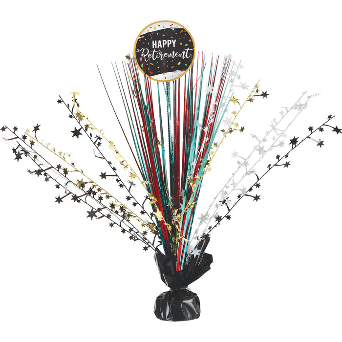 Officially Retired Spray Centerpiece with a black base, colorful metallic sprays, star accents, and a round Happy Retirement topper.