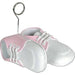 Pair of white and pink baby shoes with white laces attached to a wire loop balloon weight holder.