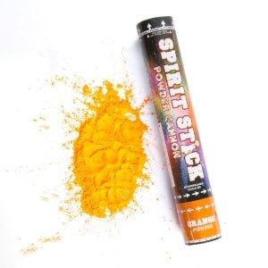 Black cylindrical powder cannon with orange label next to a burst of bright yellow-orange powder on white background.