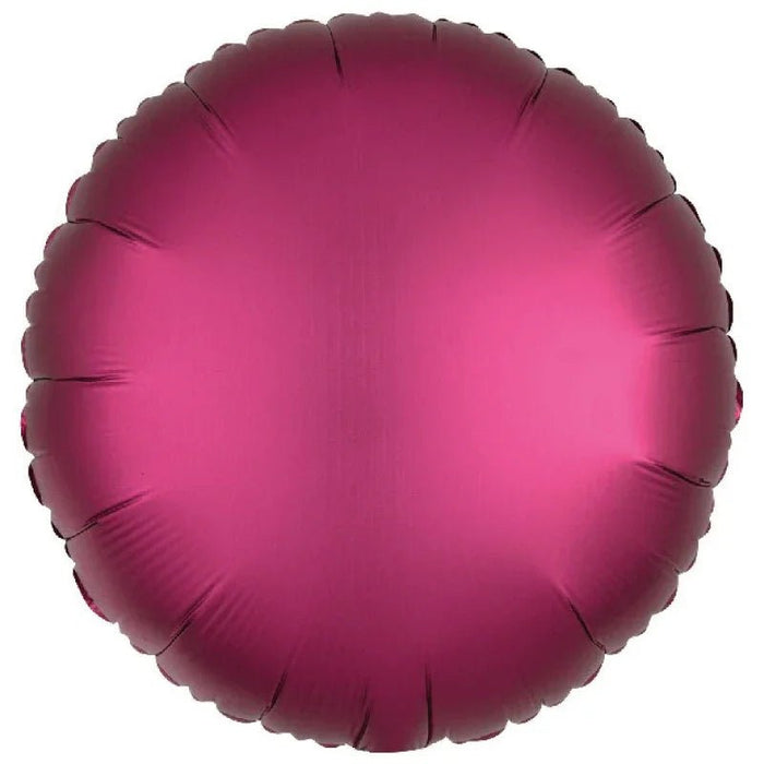 Deep magenta round mylar balloon with a satin finish and scalloped edges throughout.