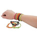 Model's wrist wearing multiple colorful woven nylon bracelets in pink, red, yellow, and green, with three additional bracelets displayed below showing the variety of color combinations available.