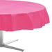 Bright pink round tablecloth draped over a table base, measuring 84 inches in diameter with a rippled fabric texture.