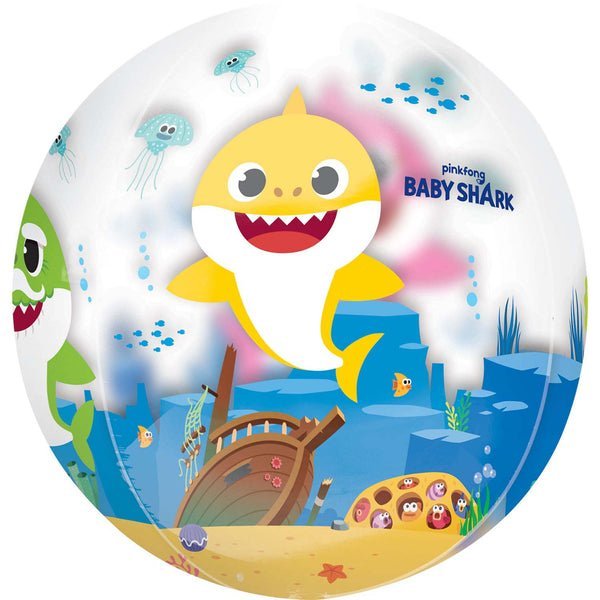 Clear spherical balloon featuring Baby Shark character in yellow and white with a smiling face, surrounded by underwater scene with jellyfish, fish, shipwreck, and sand on white background.