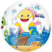 Clear spherical balloon featuring Baby Shark character in yellow and white with a smiling face, surrounded by underwater scene with jellyfish, fish, shipwreck, and sand on white background.