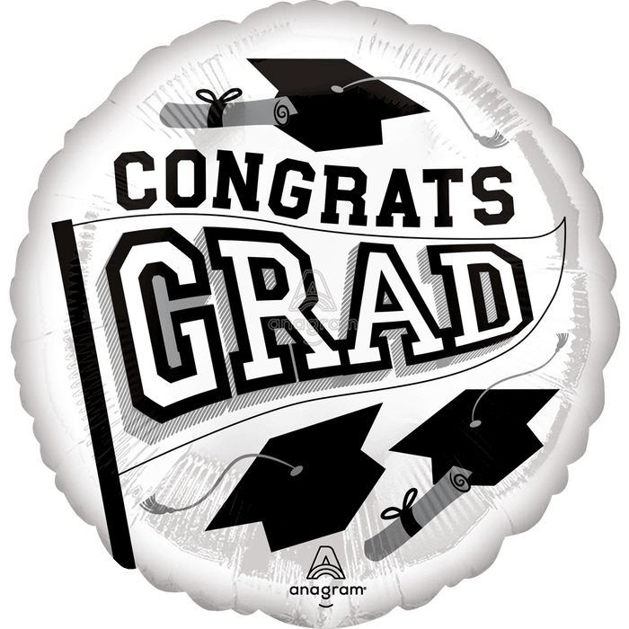 White round foil balloon with black text reading "CONGRATS GRAD" surrounded by graduation cap illustrations and diplomas.