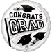 White round foil balloon with black text reading "CONGRATS GRAD" surrounded by graduation cap illustrations and diplomas.