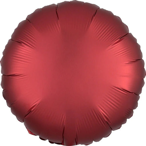 Deep red satin-finish round foil balloon with scalloped edges and subtle radial pleating throughout the surface.