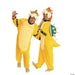 Two people wear bright yellow hooded jumpsuits with cream-colored chest panels, black studded wristbands, and oversized character heads featuring orange horns and green accents.