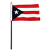 Puerto Rico flag featuring alternating red and white horizontal stripes with a dark blue triangle and white star on the left, mounted on a black stick with gold finial.