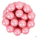 Cluster of shiny pearl pink gumballs with white highlights arranged together against a white background.