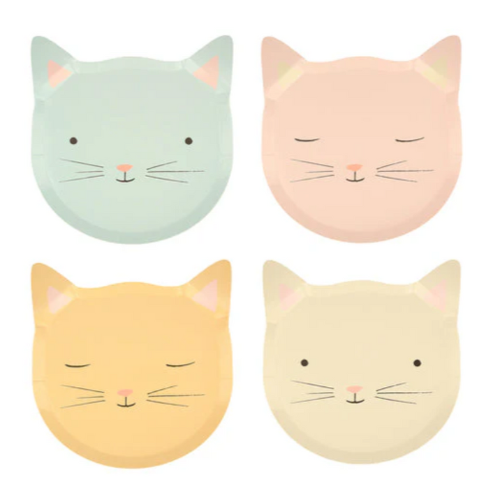 Four pastel-colored cat face plates on a white background