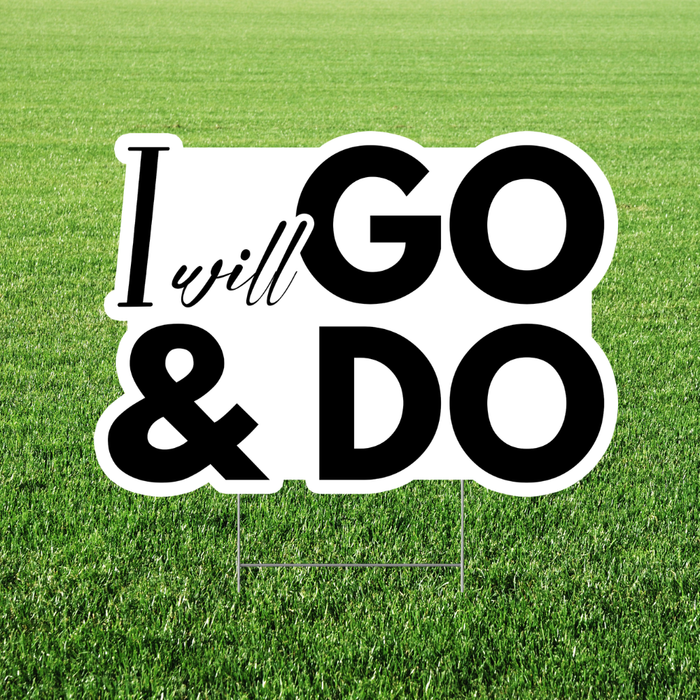 Motivational sign with 'I will go & do' on a grass background