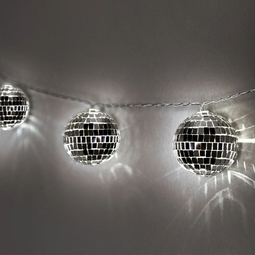 This set of New Year's Disco Ball String Lights adds a dazzling touch to any holiday decor. Boasting 10 lights on a 70.8-inch string, these energy-efficient lights are battery-operated, so there's no need for cords or plugs. Enjoy the festive ambiance in any indoor or outdoor area with these durable, long-lasting string lights.