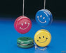 Four smiley face yo-yos in red, blue, yellow, and green hanging by white strings against a blue background.